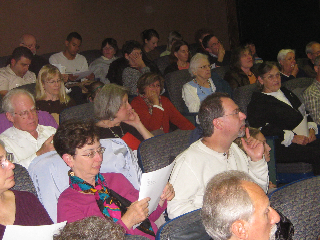 An overflow crowd filled a Coolidge Corner theater to see Prof. Louis Kruger's film, "Children Left Behind." 
