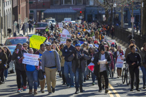 Activists march up Park Street towards the Statehouse to protest proposed buydget cuts to the Boston Public Schools. (Jesse Costa/WBUR)